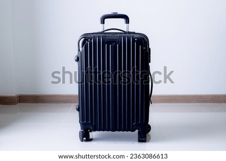 black travel bag,Luggage or suitcases in modern hotel during check-in It's time to travel, service, travel, summer vacation and vacation concept.