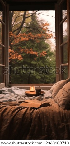 The fall and autumn season is here! Being cozy while reading a book and sipping your favorite tea or hot cocoa, yum! Royalty-Free Stock Photo #2363100713