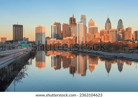 Philadelphia, Pennsylvania, USA downtown skyline at dusk on the Schuylkill River.