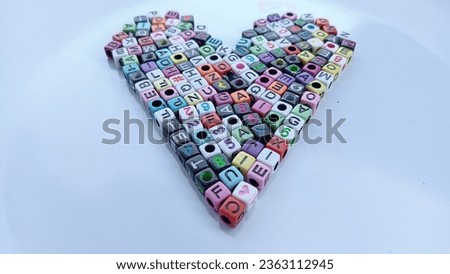 The love image is formed using letters from plastic blocks which is very beautiful

