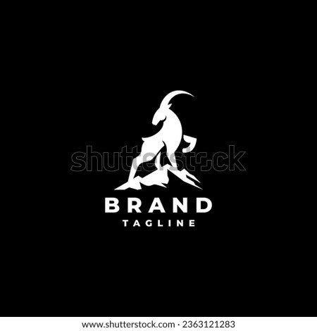 White Goat On The Mountain Logo Design. Goat standing proudly on the top of the mountain Logo Design. Royalty-Free Stock Photo #2363121283
