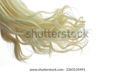 Long Curl Wig hair style fly fall explosion. Blonde wave woman wig hair float in mid air. Golden blonde wig hair wind blow cloud throw. White background isolated part Royalty-Free Stock Photo #2363135491