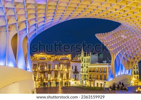 Metropol Parasol wooden structure with Seville city skyline in the old quarter of Seville in Spain at sunset Royalty-Free Stock Photo #2363159929