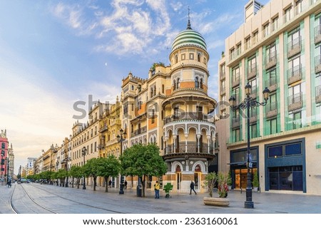 Old town in Seville, shopping street in Spain at sunrise Royalty-Free Stock Photo #2363160061
