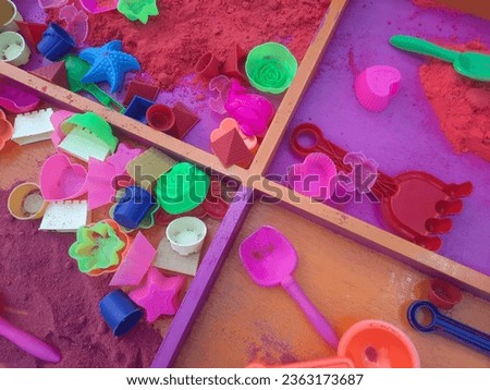 Sand toys for children with various shapes molded around them, available at night market