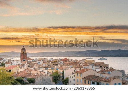 Scenic view of Saint Tropez in south of France against dramatic yellow summer sunset sky  Royalty-Free Stock Photo #2363178865