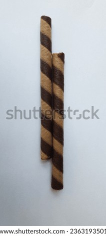 a picture of chocolate wafer roll isolated on white background