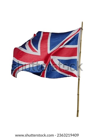 The Union Jack flag of United Kingdom English Britain flag flying in the wind on bamboo pole isolated on white background. This has clipping path.