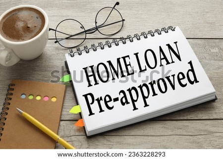 Home loan pre approval open notebook with text near coffee cup