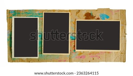 old empty photo frames, vintage photo prints, flat lay on grungy cardboard, free pics space,isolated on white  backaground