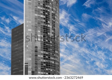 Skyscrapers La Defense (against the background of sky with clouds), commercial and business center of Paris, France