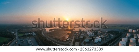 Panoramic view of Solar Photovoltaic of solar farm, solar plant rows array of on the water mount system Installation in earthen pond, Floating solar or floating photovoltaics (FPV). Morning scene Royalty-Free Stock Photo #2363273589