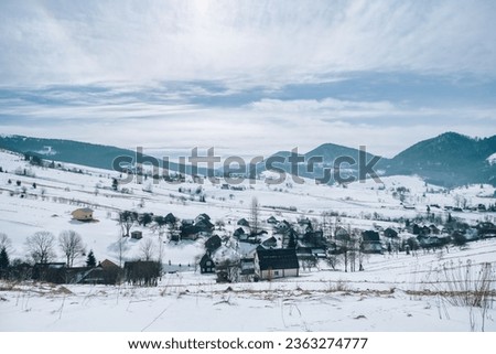 Frosty winter in Carpathian mountains with snow covered fir trees. Outdoor panorama. Artistic style post processed photo.