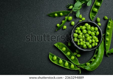 Shelled green peas in a bowl. Healthy food. Top view. Royalty-Free Stock Photo #2363294889