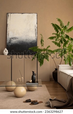 Warm and cozy composition of living room interior with mock up poster frame, brown sideboard, white armchair, stylish glass coffee table, black stool and personal accessories. Home decor. Template.