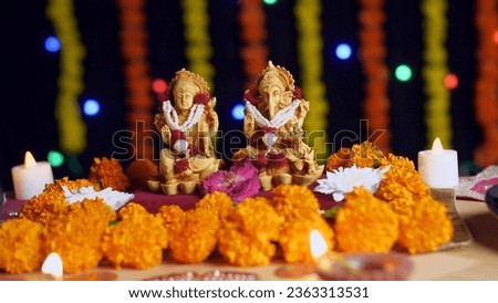 Pan shot of Hindu god Laxmi and Ganesh at Diwali festival - Festival of India. Indian temple decorated with Lord Ganesha and Goddess Laxmi for the celebration of Diwali festival Royalty-Free Stock Photo #2363313531