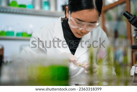 Female scientist researcher conducting an experiment in a labora
