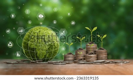 Green business concept, finance and investment for sustainability and carbon credit. Green Globe with icon and stack of silver coins the seedlings are growing on top. ESG, co2 and green tax.
