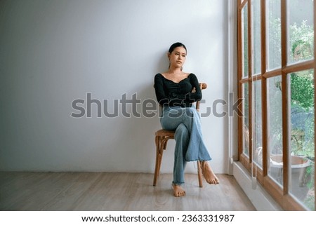 Depressed young Asian woman with mental health problem in mind need uttermost treatment from overthinking fatigue, disruptive thought, dissocial, anxiety and other mental health disorders . Royalty-Free Stock Photo #2363331987