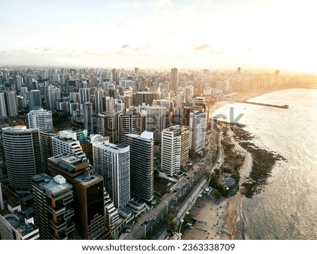 Aerial view of sunset in the city close the coast