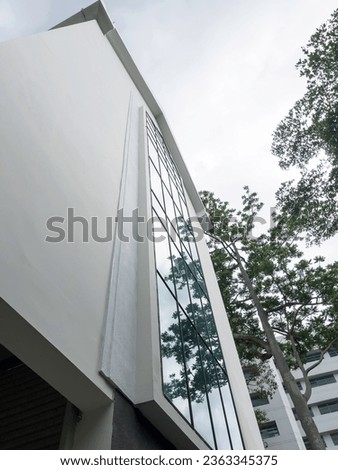Modern residential exterior with green plants, stock photo