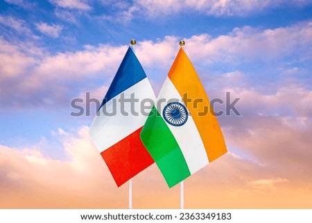 National flags of France and India against the sky at sunset. Flags.