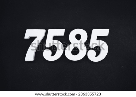 Black for the background. The number 7585 is made of white painted wood.