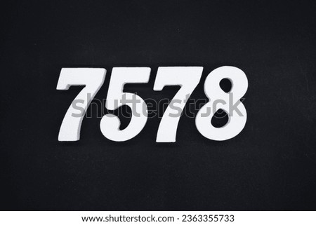 Black for the background. The number 7578 is made of white painted wood.