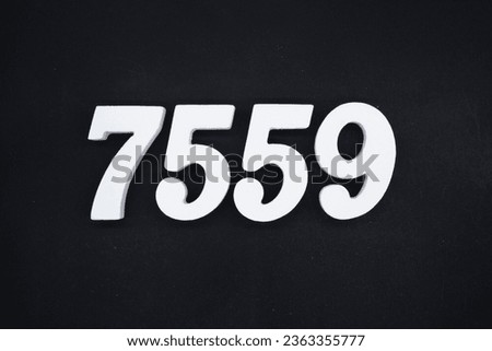 Black for the background. The number 7559 is made of white painted wood.