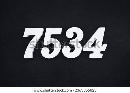 Black for the background. The number 7534 is made of white painted wood.