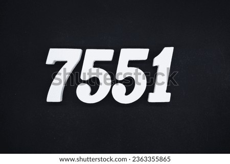 Black for the background. The number 7551 is made of white painted wood.