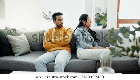 Conflict, fight and couple angry on a couch together duo to infertility, argument and toxic relationship in a home. Unhappy, divorce and man has problem with woman in a living room sofa for cheating Royalty-Free Stock Photo #2363359463