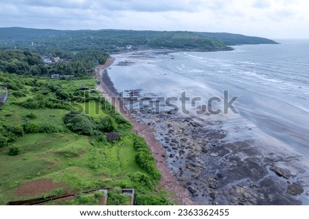 Aerial footage of Ladghar beach at Dapoli, located 200 kms from Pune on the West Coast of Maharashtra India. Royalty-Free Stock Photo #2363362455