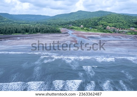 Aerial footage of Ladghar beach at Dapoli, located 200 kms from Pune on the West Coast of Maharashtra India. Royalty-Free Stock Photo #2363362487