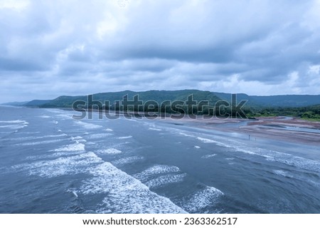 Aerial footage of Ladghar beach at Dapoli, located 200 kms from Pune on the West Coast of Maharashtra India. Royalty-Free Stock Photo #2363362517