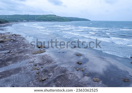Aerial footage of Ladghar beach at Dapoli, located 200 kms from Pune on the West Coast of Maharashtra India. Royalty-Free Stock Photo #2363362525