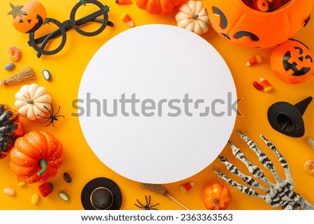 Fun-filled kid's trick or treat excitement. Bird's-eye view image of a pumpkin basket, sweets, and Halloween decorations on an orange isolated surface, ideal for text or advert incorporation