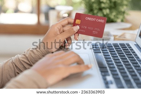 Close up credit card using for online payment, banking and shopping on the internet network with laptop computer showing credit card technology for online secured wallet top up and crucial purchase Royalty-Free Stock Photo #2363363903