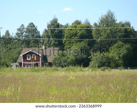 Swedish countryhouse at the forest limit Royalty-Free Stock Photo #2363368999