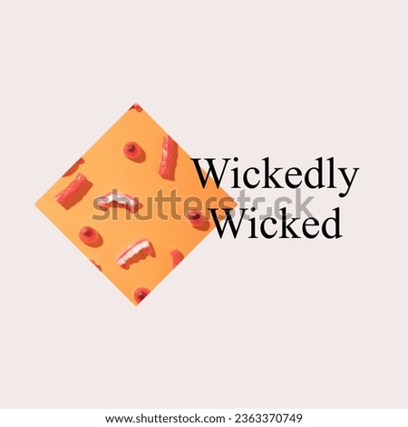 Wickedly wicked text on grey background with vampire fangs, eye and finger candies on orange. Halloween, october 31st, all hallows' eve, tradition and celebration, digitally generated image.