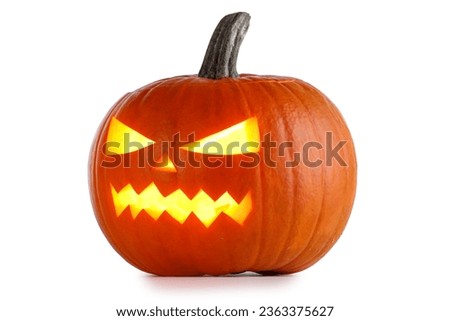 Funny Jack O Lantern halloween pumpkin with candle light inside isolated on white background Royalty-Free Stock Photo #2363375627