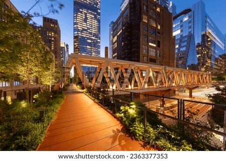 High Line Park timber wooden truss bridge in evening with Hudson Yards skyscrapers. This new section opened in 2023. Chelsea, Manhattan, New York City Royalty-Free Stock Photo #2363377353