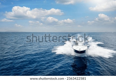 Aerial front view of a speedboat cruising over the ocean with copy space Royalty-Free Stock Photo #2363422581