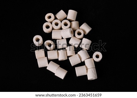 Ceramic material filler for the external filter of the aquarium. Royalty-Free Stock Photo #2363451659