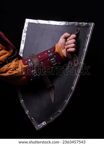 Man holding reconstruction knight shield