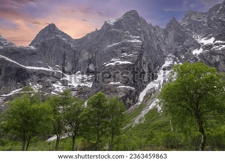The Troll Wall (English) or Trollveggen (Norwegian) is part of the mountain massif Trolltindene (Troll Peaks) in the Romsdalen valley in Rauma Municipality in Moere og Romsdal county, Norway. Royalty-Free Stock Photo #2363459863