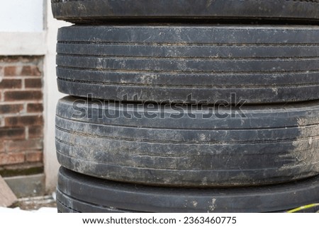 pile of used truck tires with damaged tire rubber Royalty-Free Stock Photo #2363460775
