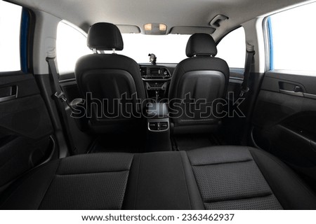 Car interior back view with isolated windows. Car detailing service theme Royalty-Free Stock Photo #2363462937