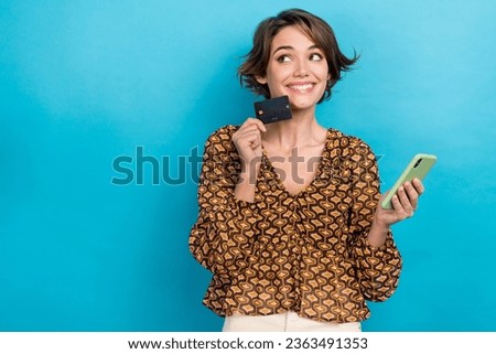 Photo of using credit payment card bank account ecommerce advert bob hair woman hold iphone look mockup isolated on blue color background