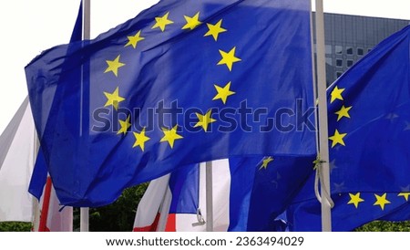 Flags of the European Union waving in the wind - travel photography in Paris France
